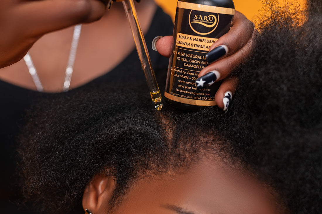 Applying Saru Organics Scalp and Hairfluence Growth Stimulant Oil directly to a dry itchy scalp for infection relief.