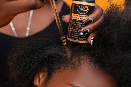 Applying Saru Organics Scalp and Hairfluence Growth Stimulant Oil directly to a dry itchy scalp for infection relief.